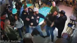  ?? EASTERN DISTRICT OF CALIFORNIA COURT RECORDS ?? A man identified by authoritie­s as Hells Angels “enforcer” Michael Mahoney delivers a knockout punch during a bar fight in Vacaville.