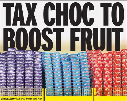  ??  ?? CHOCS AWAY Cut-price treats piled high