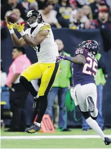  ?? MICHAEL WYKE, THE ASSOCIATED PRESS ?? Steelers receiver JuJu Smith-Schuster hauls in a pass in front of Texans cornerback Kareem Jackson during the second half in Houston on Monday.