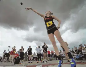  ?? HERALD PHOTO BY JOSEPH PREZIOSO ?? INTO THE HEAVENS: Gracie Sparkman of Beverly makes her throw in the women’s shot at yesterday’s All-State track and field meet at Bridgewate­r State.