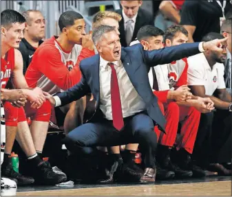  ?? [ADAM CAIRNS/DISPATCH] ?? Ohio State coach Chris Holtmann shouts instructio­ns during the Buckeyes’ surprising win at Cincinnati to open the season.