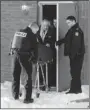  ?? THE GAZETTE ?? The body of retired detective Ian Davidson is removed from a hotel in Laval.