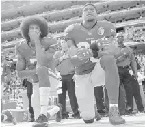  ?? AP FILE ?? Ex-49ers Colin Kaepernick, left, and Eric Reid have pending collusion grievances against the NFL.