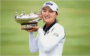  ?? — AFP ?? Over the moon: Ko Jin-young of South Korea poses with the winner’s trophy in the Women’s Australian Open yesterday.