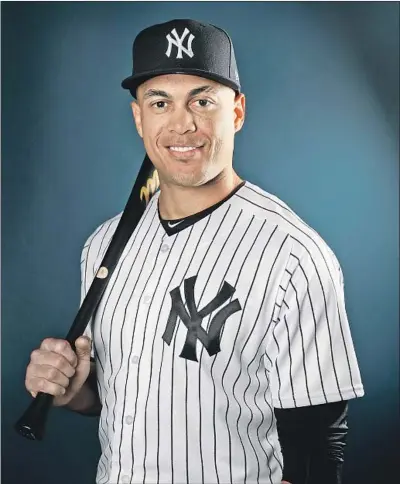  ?? Elsa Garrison Getty Images ?? GIANCARLO STANTON led baseball with 59 home runs a year ago for the Miami Marlins. By teaming him with Aaron Judge (52 home runs in 2017), the Yankees hope to build a lineup that will give opposing pitchers nightmares.