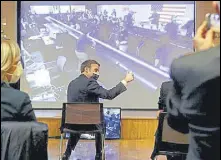  ?? AGENCIES ?? Nasa officials (top) catch the action from mission control in Pasadena, California; a team member (right) celebrates the touchdown; French President Emmanuel Macron (above) gives the thumb-up as he sits in front of a screen at the French National Center for Space Studies, in Paris.