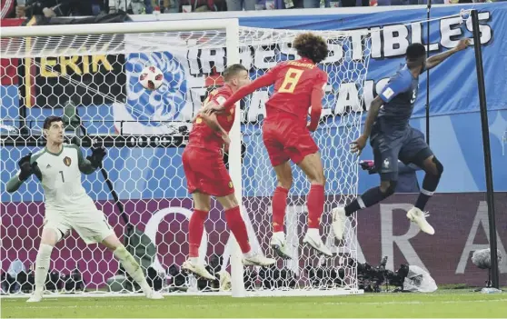  ??  ?? 2 France defender Samuel Umtiti, right, heads home the only goal against Belgium as Les Bleus edged past their neighbours to reach the World Cup final.