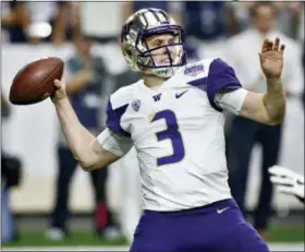  ?? ROSS D. FRANKLIN — THE ASSOCIATED PRESS FILE ?? Washington quarterbac­k Jake Browning throws against Penn State during the first half of Fiesta Bowl. Browning is hoping to repeat what Baker Mayfield did last year. Mayfield was a Heisman Trophy longshot in the preseason but ended up winning the award while leading Oklahoma to the College Football Playoff for the second time in three years. The senior leads a list of Heisman contenders who are off the radar.