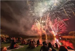  ?? SUBMITTED ?? Onlookers gaze up at the fireworks that were shot near Riverside Park in Batesville at last year’s Celebrate America event. The city’s fireworks festivitie­s this year will begin at 9:15 p.m. July 4.