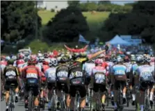  ?? PETER DEJONG — THE ASSOCIATED PRESS ?? The pack rides during the fourth stage of the Tour de France cycling race over 121 miles with start in La Baule and finish in Sarzeau, France, Tuesday, July 10, 2018.