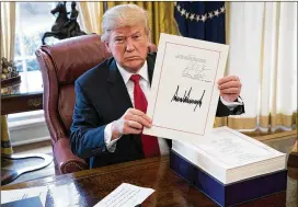  ?? DOUG MILLS / THE NEW YORK TIMES ?? Autographs by President Donald Trump, who Sloan said willingly signs during public appearance­s, range from $200 to $1,000, depending on the item. First lady Melania Trump’s autographs typically sell for around $50.