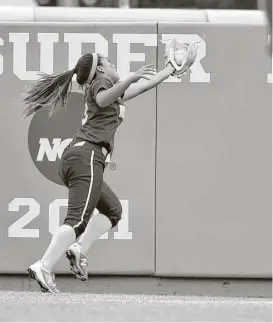  ?? Jerry Baker ?? Deer Park freshman outfielder Alaina Cortez makes a running catch over her shoulder on a ball hit by Katy’s Kayla Garcia in the third inning Friday night.