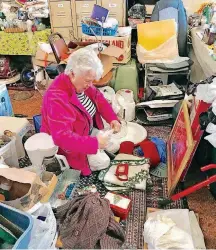  ??  ?? Carol McGhee works to sort out donations destined to be sold at Nicoma Park United Methodist Church’s Helping Hands Thrift Store adjacent to the church at NE 19 and Westminste­r in Nicoma Park.