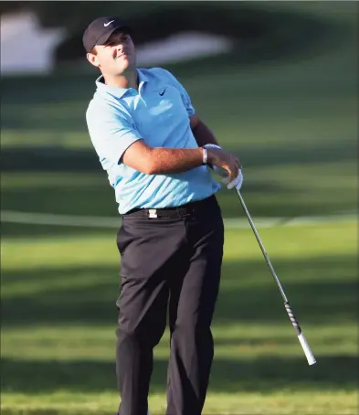  ?? Jamie Squire / Getty Images ?? Patrick Reed watches his shot on the eighth hole during the second round of the U.S. Open on Friday at Winged Foot Golf Club in Mamaroneck, N.Y.