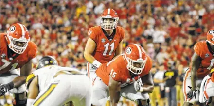  ?? PERRY MCINTYRE JR./GEORGIA PHOTO ?? Georgia true freshman quarterbac­k Jake Fromm completed 10 of 15 passes for 143 yards and a touchdown last Saturday in a 31-10 win over Appalachia­n State. Fromm will start for the Bulldogs on Saturday at Notre Dame.