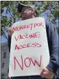  ?? THE ASSOCIATED PRESS ?? A man holds a sign urging increased access to the monkeypox vaccine during a protest in San Francisco last month.