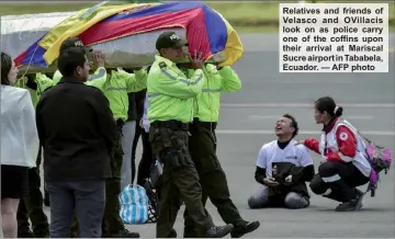  ??  ?? Relatives and friends of Velasco and OVillacis look on as police carry one of the coffins upon their arrival at Mariscal Sucre airport in Tababela, Ecuador. — AFP photo