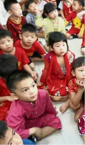  ??  ?? Children from UCSI Child Developmen­t Centre listening intently as their teacher explains to them about nasi lemak, the all-time Malaysian favourite. — LOW LAY PHON/ The Star