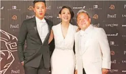  ??  ?? From left, Hong Kong director Derek Tsang, Taiwanese actress Bowie Tsang and Hong Kong actor Eric Tsang arrive at the 53rd Golden Horse Awards in Taipei, Taiwan.