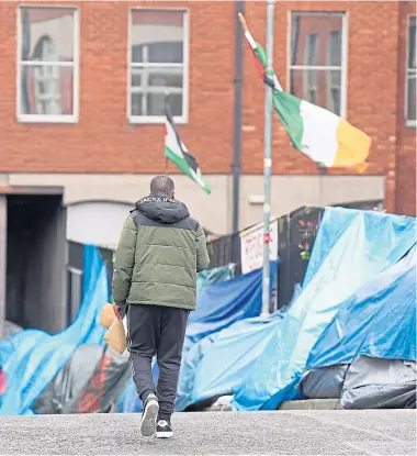  ?? ?? Tents house asylum seekers in Dublin, which has seen rioting over the situation.