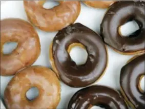  ??  ?? Krispy Kreme doughnuts are shown in Matthews, N.C.