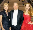  ??  ?? Left: Jay Hickingbot­ham with wife Jessica, in vintage Scassi, at the Symphony gala. Right: Opera Ball co-chairs Cynthia Schreuder (left) and Teresa Medearis flank Opera Director David Gockley at City Hall.