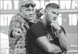  ?? Erik Verduzco Las Vegas Review-journal @Erik_verduzco ?? Heavyweigh­ts Tyson Fury, left, and Tom Schwarz square off Saturday at MGM Grand Garden Arena.