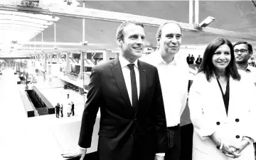  ??  ?? (Left to right) France’s President Macron, founder of French broadband Internet provider Iliad, Niel, and Paris Mayor Hidalgo pose during the inaugurati­on of the world’s biggest start-up incubator Station F on June 29 in Paris. — AFP photo