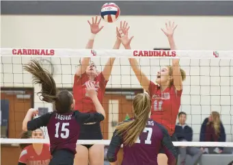  ?? DAVID GARRETT/SPECIAL TO THE MORNING CALL PHOTOS ?? Parkland’s Elena Pursell and Maddi Siggins jump to block a shot by Garnet Valley on Monday.