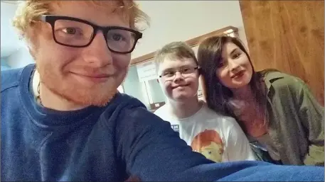  ??  ?? Ed Sheeran takes a selfie with Shane and Lisa Fortune from Enniscorth­y.