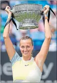  ?? ?? Petra Kvitova lifts the trophy