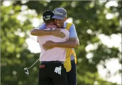  ?? MATT YORK — THE ASSOCIATED PRESS ?? Justin Thomas celebrates with his caddie Jim “Bones” Mackay after winning Sunday’s PGA Championsh­ip in a playoff against Will Zalatoris at Southern Hills Country Club.