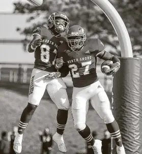  ??  ?? North Shore running back Rashaad Johnson (27) was among the Mustangs’ seven ball carriers and scored on a 35-yard touchdown run in the second quarter.