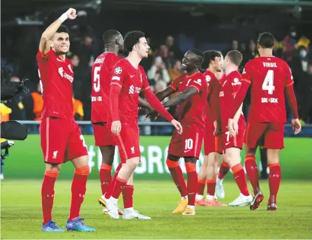  ?? EPA-Yonhap ?? Liverpool players celebrate the team’s win after the UEFA Champions League semifinal, second-leg match against Villarreal CF in Villarreal, Spain, Tuesday.
