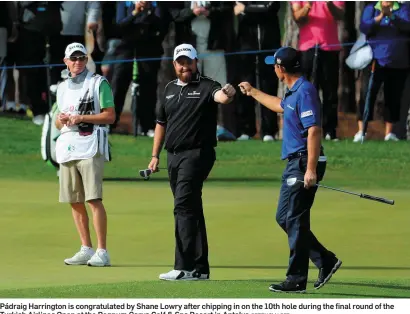  ?? GETTY IMAGES ?? Pádraig Harrington is congratula­ted by Shane Lowry after chipping in on the 10th hole during the final round of the Turkish Airlines Open at the Regnum Carya Golf & Spa Resort in Antalya