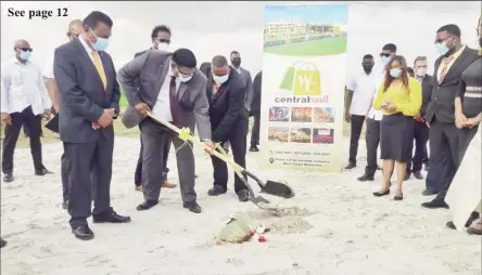  ??  ?? President Irfaan Ali (second from left) and project developer Hemraj Albert turning the sod