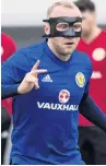  ??  ?? MASKED BALL Hibs’ Dylan McGeouch trains in Peru