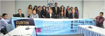  ??  ?? Yii (seated centre), flanked by Beena (seated, second right) and councillor Peter Chia, joins members of Curtin Malaysia’s management team in a photo-call.