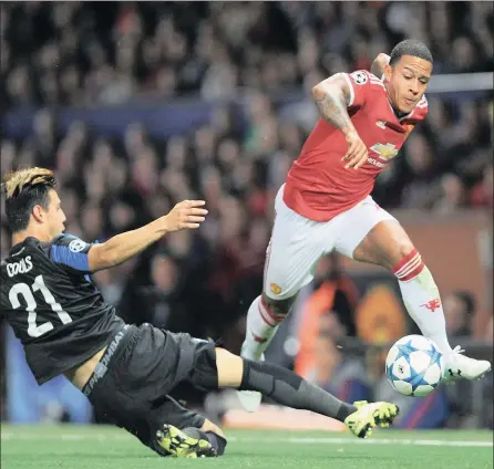  ?? PICTURE: EPA ?? DAZZLING: Manchester United’s Memphis Depay (right) beats Club Bruge’s Dion Cools during their Champions League first leg play-off at Old Trafford in Manchester on Tuesday. Depay scored two goals and set up a third in United’s 3-1 win.