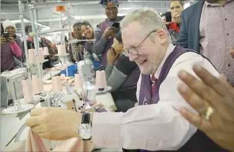  ?? Picture: ARMAND HOUGH ?? ON THE RISE: Department of Trade and Industry Minister Rob Davies is all smiles in a visit to the Prestige Clothing factory in Maitland to assess the impact of R10 million invested in it.