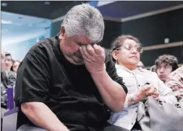  ??  ?? Roger Varela, father of fallen Army Pfc. Alejandro Varela, weeps Friday as he attends a special ceremony at Spring Valley High School, where students present remembranc­e flags to the families of two young Americans who died while serving their country.