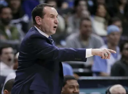  ?? JULIE JACOBSON — ASSOCIATED PRESS ?? Duke coach Mike Krzyzewski gestures during the second half of his team’s game with North Carolina in the Atlantic Coast Conference tournament semifinals in New York on Friday. Duke will be appearing in the NCAA Tournament for the 23rd straight year.