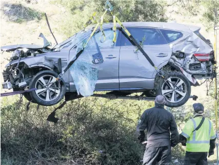  ?? Picture; AP ?? A crane is used to lift the car that had Tiger Woods inside when it crashed on Tuesday