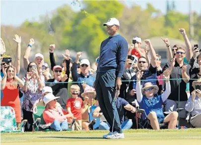  ??  ?? The highlight of Tiger Woods’ opening-round 68 at Bay Hill came at No. 7 when he sank a 71-foot putt for birdie to the delight of the crowd. MIKE EHRMANN/GETTY IMAGES