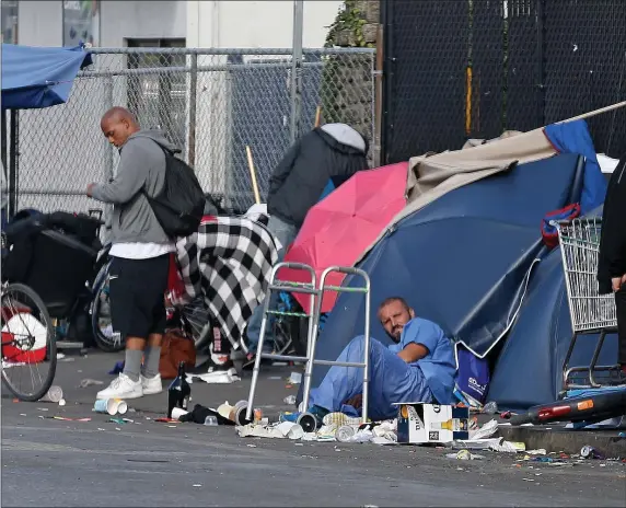  ?? MATT STONE / HERALD STAFF ?? ‘IT’S GETTING WORSE:’ Tents are back up on the sidewalk of South Hampton Street in the area of ‘Methadone Mile’ in Boston.