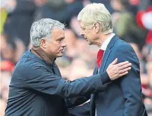  ?? PAUL ELLIS/AFP/GETTY IMAGES ?? Manchester United manager Jose Mourinho, left, greets Arsenal’s Arsene Wenger at Old Trafford on Sunday. Wenger has tendered his resignatio­n from Arsenal after 22 seasons.