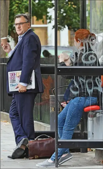  ??  ?? Why are we waiting? Ed Balls and a young woman at a north London bus stop yesterday