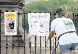  ?? AP ?? Family of Ricardo Valdes, who disappeare­d on the road on May 25, places missing posters during a protest in Monterrey, Nuevo Leon state, Mexico, on Thursday.