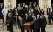  ?? AP PHOTO/MATT ROURKE ?? A casket is carried out of Rodef Shalom Congregati­on after the funeral services for brothers Cecil and David Rosenthal on Tuesday, in Pittsburgh. The brothers were killed in the mass shooting last week at the Tree of Life Synagogue.