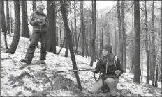  ?? BRITTANY PETERSON/AP ?? GRADUATE STUDENT ARIELLE KOSHKIN (LEFT) takes notes as snow hydrologis­t Anne Nolin (right) measures snow reflectivi­ty at the site of the 2021 Caldor Fire, April 4, near Twin Bridges, Calif.